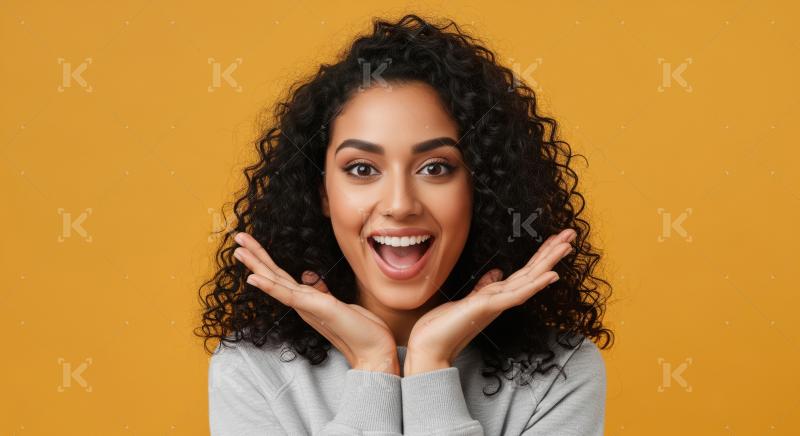 A joyful young Indian woman with curly hair and a radiant smile