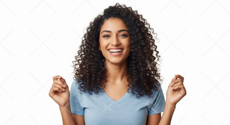 A joyful young Indian woman with curly hair and a radiant smile
