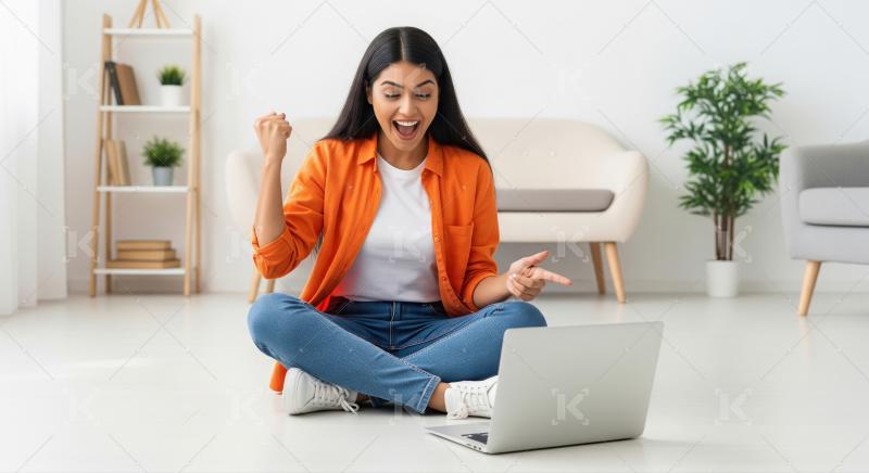 Happy woman celebrates victory on laptop in bright living room