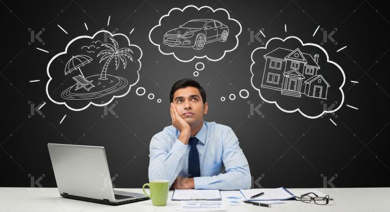 Businessman dreaming of future: vacation, car, and new home