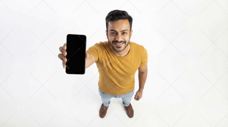 Happy Young Man Showing Blank Smartphone Screen