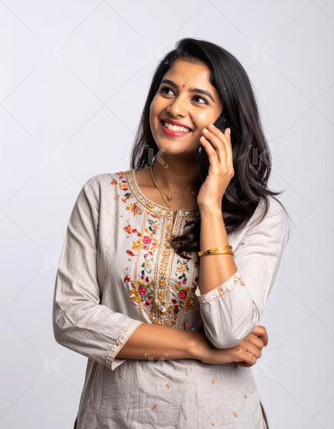 Young beautiful indian woman talking on smartphone standing on w