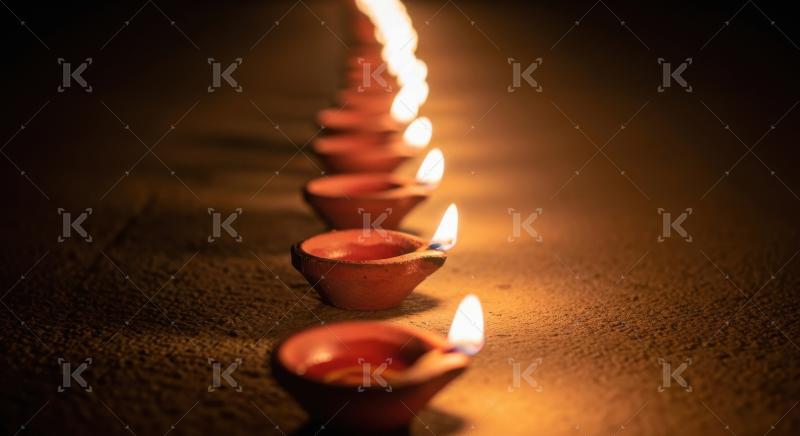 Close up of oil lamp on rangoli on diwali festival