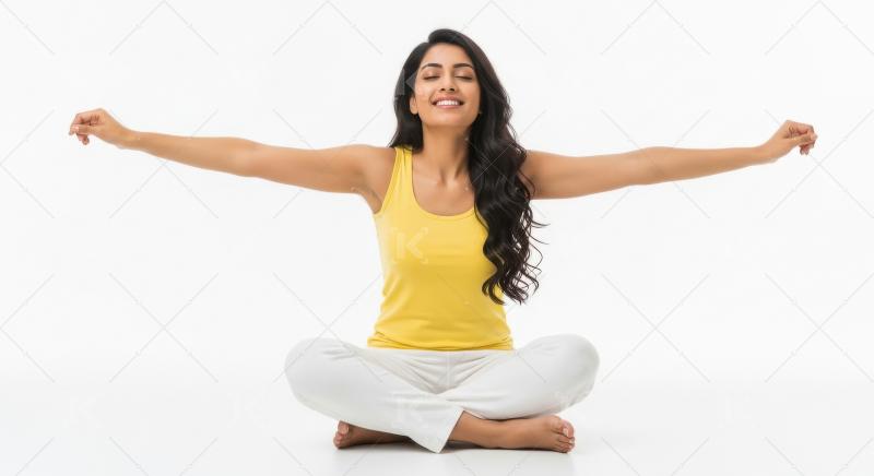 Young beautiful indian woman sitting on white background