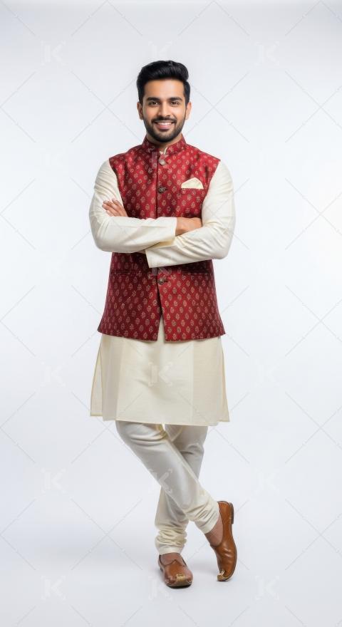 Young indian man wearing traditional kurta standing on white bac