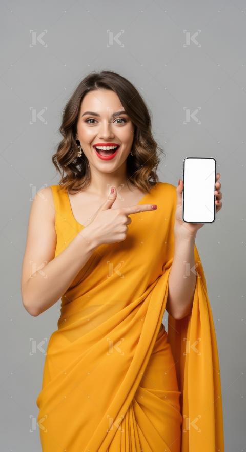 Young indian woman pointing with finger on blank mobile screen
