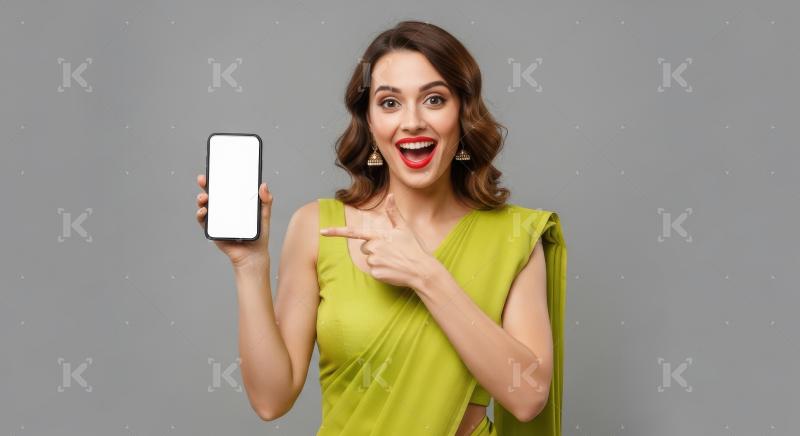 Young indian woman pointing with finger on blank mobile screen