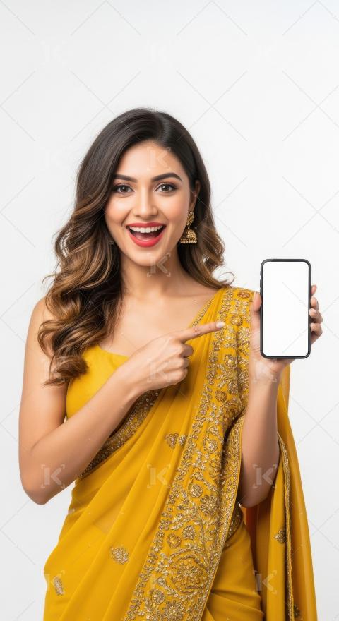Young indian woman pointing with finger on blank mobile screen